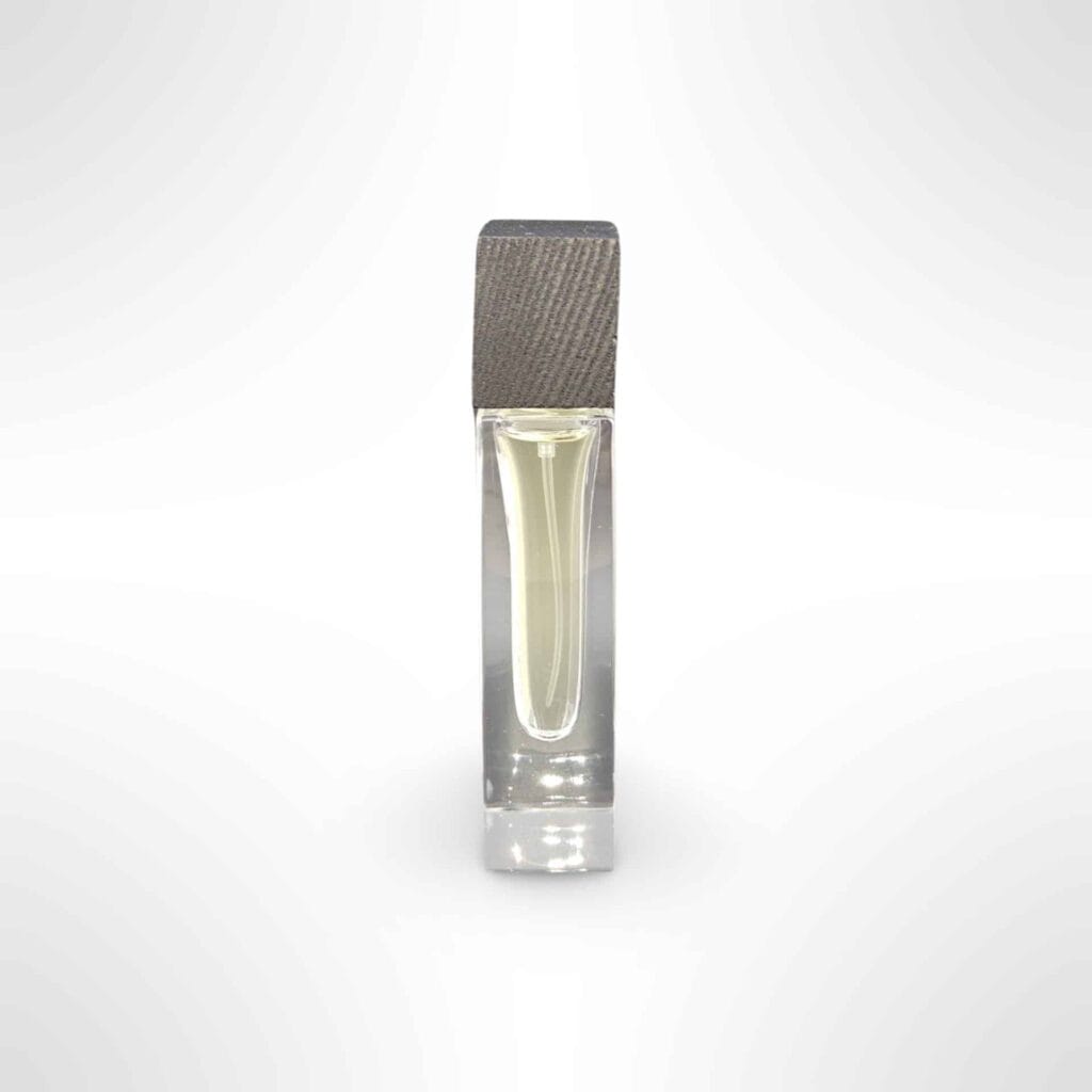 A Grasgróinn eau de parfum bottle with its grey ash wood cap
