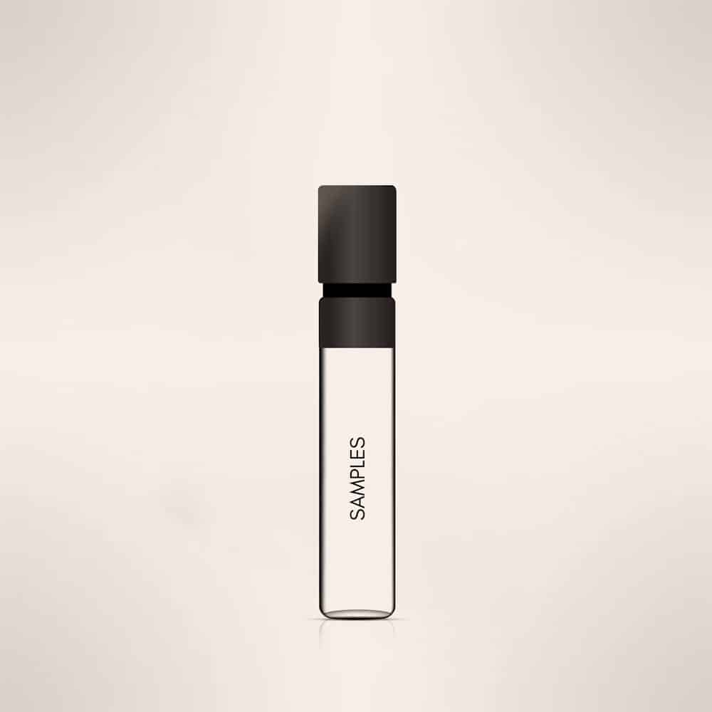 A small, clear glass vial with a black cap containing an unknown liquid. The vial has "SAMPLES" written vertically on its side, hinting at its mysterious contents. Could it be a niche perfume from the HOUSE of ZIGGIMAY? The background is a plain, light beige color.