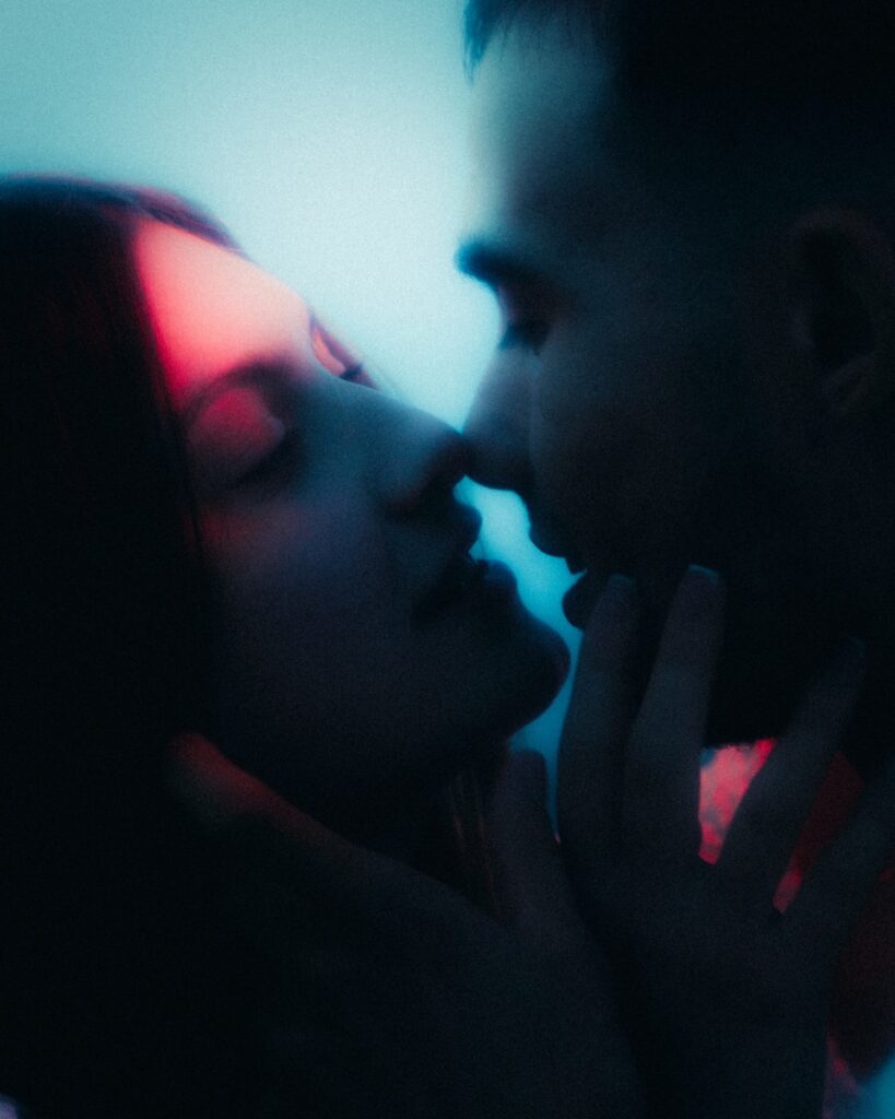 Perfume Pheromones A couple is about to kiss.