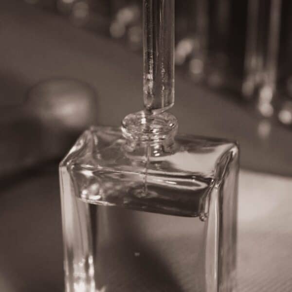 a bottle of perfume sitting on top of a table