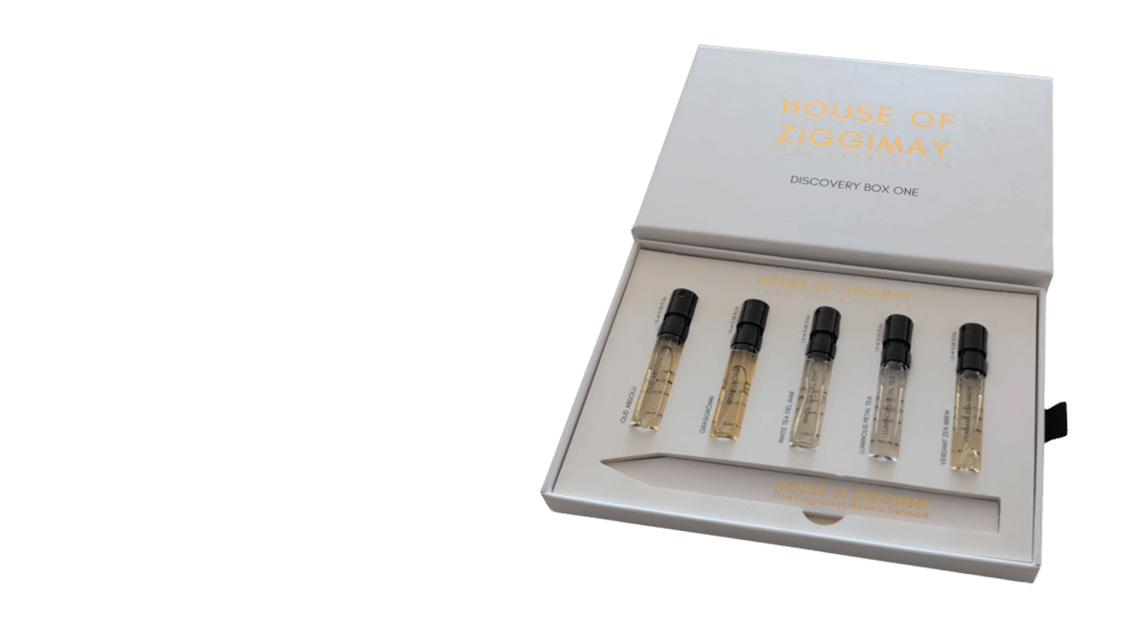 Discovery Box One, open, with five 1.5 ml sample vials and a paper tester strip