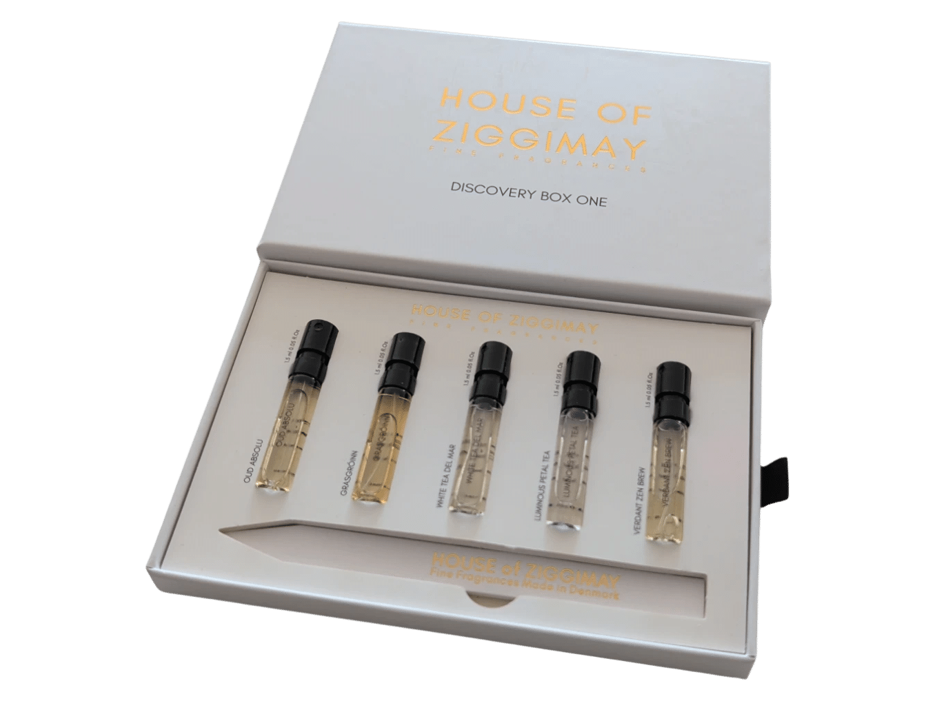 Fragrance families, and where the system breaks Discovery Box One, open, with five 1.5 ml sample vials and a paper tester strip